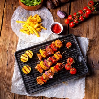 Rustic shish kebab skewers with marinated ham meat paprika and red onion