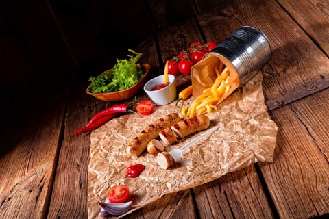 Rustic bratwurst with pommes and hot ketchup
