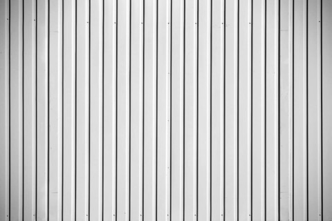 Close-up of the corrugated metal wall of a construction container