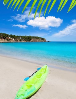 Cala Llenya in Ibiza kayak with turquoise water in Balearic islands