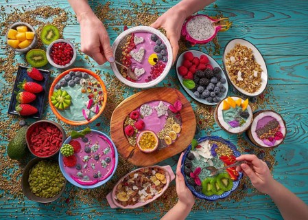Acai bowl smoothie and Spirulina algae with chia berries and fruits healthy food