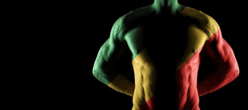Republic of the Congo flag on muscled male torso with abs, black background
