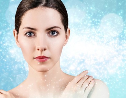 Portrait of young and beautiful woman over winter Christmas background. Spa concept