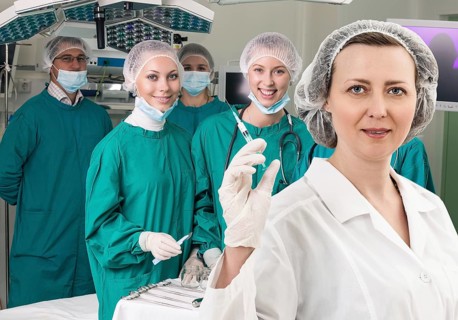 Adult female anesthetist with syringe on the surgery teem background