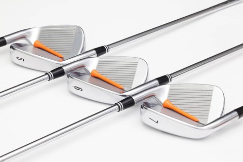 Titanium golf clubs on the white background
