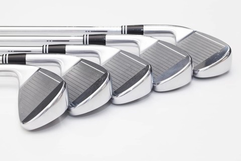 Titanium golf clubs on the white background