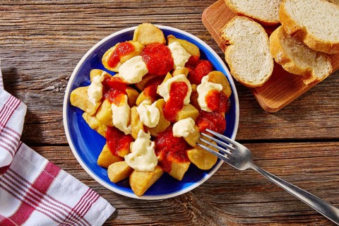 Tapas Patatas Bravas potatoe fries with tomato and mayonaise from Spain