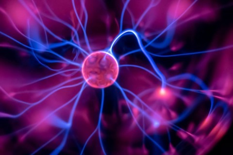 An image of a plasma lamp with moving light beams