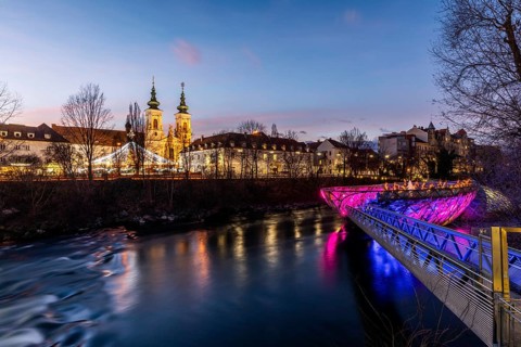 Illuminated Murinsel, Mariahilferkirche in the background, night shot, Graz, Styria, Austria,