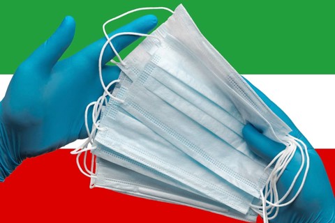 Doctor holding face masks in hands medical blue gloves on background national flag Islamic Republic