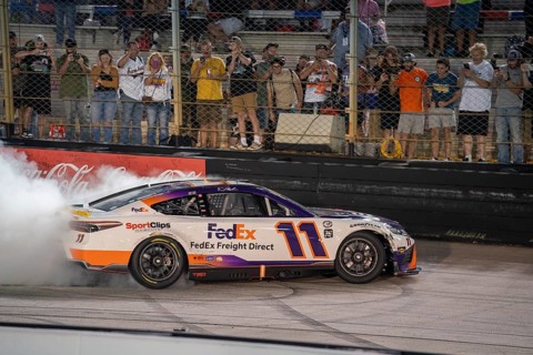NASCAR Cup Series Driver Denny Hamlin (11) celebrates his win for the Bass Pro Shops Night Race at