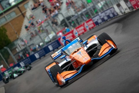 SCOTT DIXON (9) of Auckland, New Zealand runs through the streets during the Honda Indy Toronto in