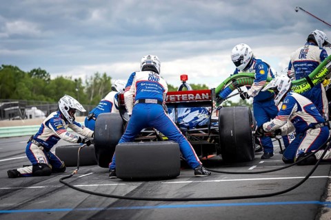 LINUS LUNDQVIST (R) (8) of Stockholm, Sweden comes down pit road for service during the XPEL Grand