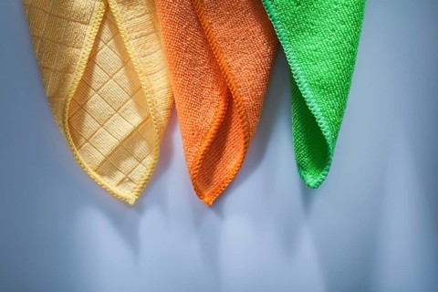 Set of new household dishrags on white surface