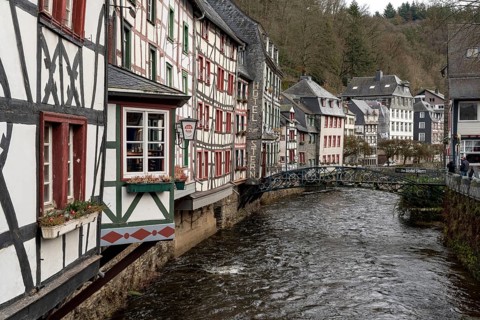 City Monschau in Region national park Eifel. Old town with old houses and river Rur