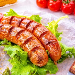 Grilled krakauer sausage with boiled corn and green salad