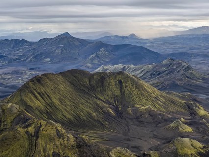 View from Mount Sveinstindur, volcanic landscape, moss-covered hills, mountains, Icelandic