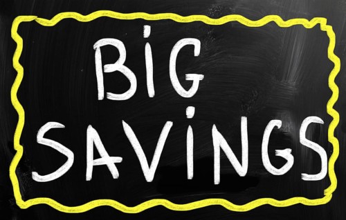 Big savings handwritten with white chalk on a blackboard