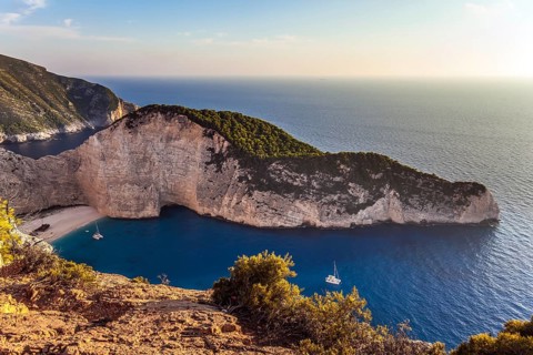 Greece. The magical island of Zakynthos. The cove with a small sandy beach. The famous rusty ship,