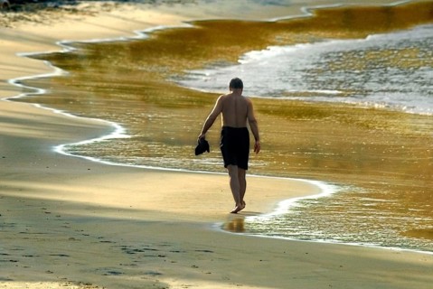 Tourist dawn walk in the beach at Kovalam kerala India