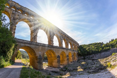 The bridge was built in Roman times on the river Gardon. Three-tiered aqueduct Pont du Gard - the