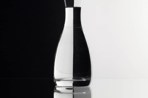 Glass of water on the black and white background on the glass table
