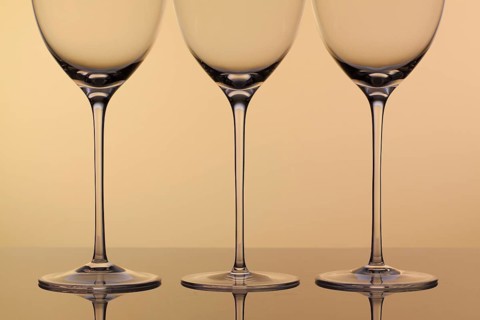Three empty glasses of wine on a clean background