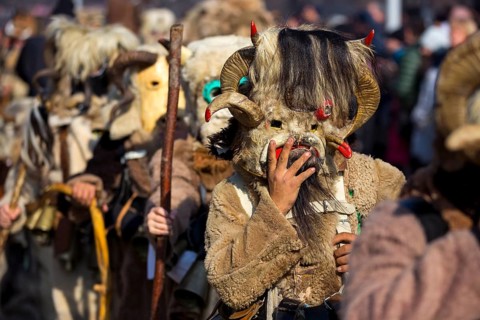 Participants take part in the International Festival of Masquerade Games Surva. The festival