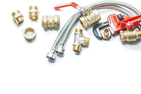 Adjustable wrench pipe fittings isolated on white