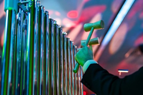 Musical instrument - tubular bells struck with a hammers during a concert