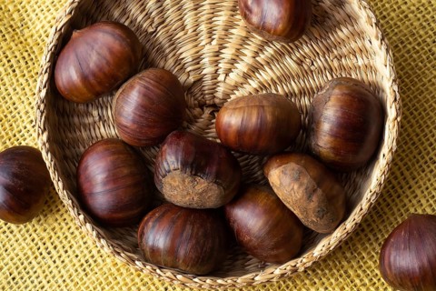 Fresh edible chestnuts in a basket