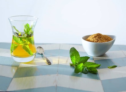 Green tea with mint Moroccan style on wood blue white table