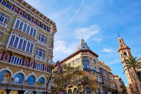 Valencia Casa Isla de Cuba and Santa Catalina tower church in La Paz street of Spain