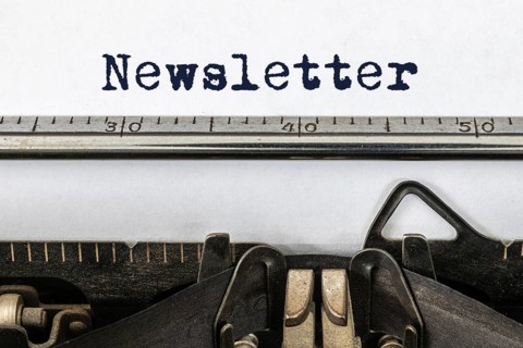 A vintage typewriter with the word newsletter