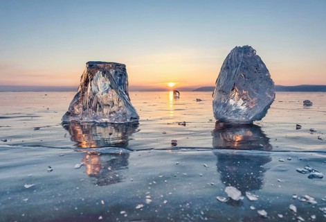 Sunset on frozen Lake Baikal landscape, sunlight is refracted in pieces of ice