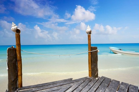 Holbox tropical Island wooden pier in Quintana Roo of Mexico