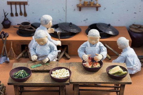 Korean monk figures preparing traditional korean food
