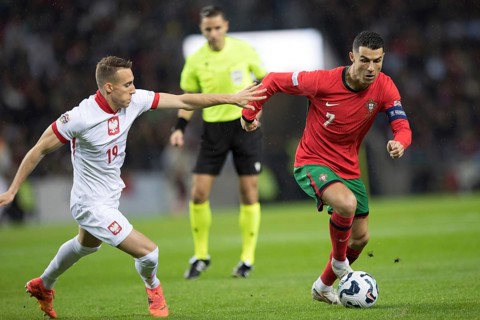 Football match, captain Cristiano RONALDO CR7 Portugal on the ball right in a duel with Dominik
