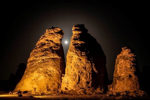 Full moon behind the columnar rocks of Gharameel, Hail region, Al Ula, Saudi Arabia, Asia