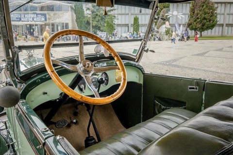 Lisbon, Portugal - Oct 15, 2023: Green interior with steering wheel and car dashboard of vintage