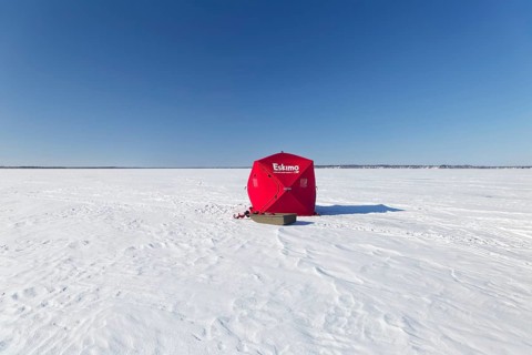 Winter, icefishing tent on the frozen Saint Lawrence River, Province of Quebec, Canada, North