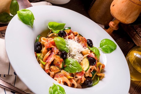 Ribbon Pasta with courgette and olives in tomato sauce