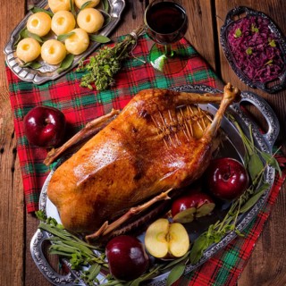 Roast Christmas duck with apples