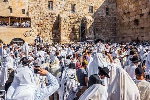 The ceremony at the Western slope of the Temple Mount in Jerusalem. Jews praying in festive white