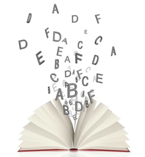 Open book with flying letters lying isolated on white