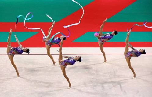 Sofia, Bulgaria - 16 September, 2022: Members of team China in action with 2 balls and 3 ribbons