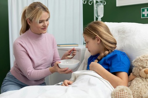 A caring moment between a mother and her daughter, showcasing love and support in a hospital