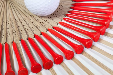 Typical Japanese hand fan made of bamboo and golf equipments