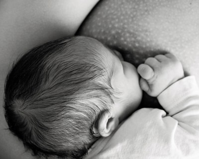 Mother breast feeding her baby