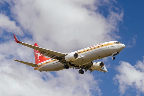 MELBOURNE, AUSTRALIA - SEPTEMBER 07, 2024: A Qantas Boeing 737-800 in retro livery flies into